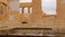 Dog sleeping on stairs of ruins of majestic ancient building, cultural heritage