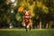 dog successfully catching frisbee, tail wagging in excitement