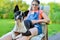 Dog and teenage girl resting in the garden