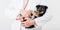 Dog in Vet doctor hands. Doctor veterinarian keeps puppy in hand in white coat with stethoscope. Baby pet on checkup in vet clinic
