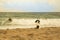 Dog waits for his buddy surfer. Lifeguard!