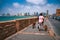 Dog-Walking on Tel Aviv-Jaffa Promenade with Skyline View