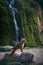 dog at the waterfall. Nova Scotia Duck Tolling Retriever in nature