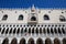 Doge Palace building facade in Venice, blue sky in Italy