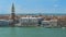 Doge Palace and Saint Mark tower, many people in Venice streets, boats on canal