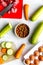 Dogfood set with cut vegetables and knife on table background top view