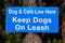 Dogs and cats live here keep dogs on leash sign