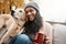 Dogs dont just fill your heart - they make it stronger too. a young woman relaxing with her dog outside.