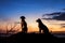 Dogs silhouette graces the horizon against a picturesque sunset