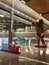 Doha Airport Giant Kaws KAWS Sculpture Art Toy Small Lie Hamad International Terminal Lobby Interior Design Qatar HIA Persian Gulf