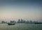 Doha city urban skyline view and dhow boat in qatar