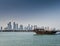 Doha city urban skyline view and dhow boat in qatar