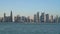 Doha Qatar skyline with traditional Qatari Dhow boat sailing infront of skyscrapers