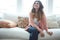 Doing nothing and totally loving it. a beautiful young woman relaxing on a sofa at home.