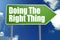 Doing The Right Thing word with green road sign