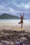 Doing yoga on a Cambodian beach