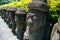 Dol hareubang stone grandpa sculpture at Cheonjiyeon Falls in Jeju Island, Korea