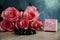 Dolce vita roses with pink present box on wood background