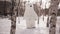 Doll giant bear dancing in a snowy park