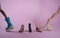 Doll shoes with two dolls walking on pink background