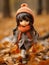 a doll wearing an orange scarf and hat is walking through the leaves