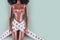 Doll wrapped in measuring tape. Tied up unrecognizable plastic doll, weight loss, fasting and slimming, diet, anorexia