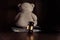 Dollar banknotes, judge gavel and teddy bear on a wooden table. Divorce and alimony concept