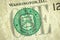 Dollar bill close up. Detail of US one dollar banknote with green seal symbol. Macro view of single dollar bill