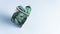 Dollar bill in form of heart - as symbol of love, success and wealth. Copy space
