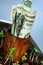 Dollar bills growing in pot with seedling