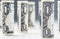 Dollar. Dollar banknotes roll in other positions. American US currency on white board and defocused background