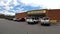 Dollar General retail store exterior building pan and parked cars