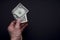 Dollar in hand. Top view of male hand holding a dollar banknotes. Currency paper money, bills in hand.