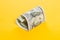 Dollar money. Heart of 100 bill note on yellow background. Deposit interest and commercial money investment profit concept