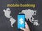 Dollar sign on smart phone and mobile banking concept