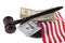 Dollars, wooden hammer and US flag isolated on white background