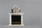 dollhouse interior - chimney with clock, candlestick, vase on mantelshelf isolated on gray background