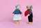 Dolls Elderly man and woman. Grandfather gives grandmother a heart a symbol of love and trust. Valentine`s day, love