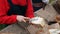 Dolly parallax shot of woman puts butter on fresh organic bread