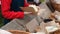 Dolly parallax shot of woman wraps fresh organic bread in paper