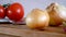 Dolly. Radish onion tomato knife and other vegetables on a kitchen board