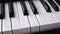 Dolly slider close shot shallow depth of field piano keyboard electric keyboard musical instrument black and white key