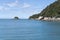 Dolly Varden island and green cape at Anchorage bay, near Kaiteriteri, Abel Tasman park, New Zealand