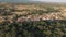 Dolly zoom over old small village with tile roofs