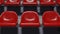 Dolly zoom shot of rows of red seats at sports facility. 3d rendering animation