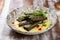 Dolma in grape leaves with lamb on mushroom julienne. Haute cuisine. On a wooden background