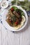 Dolma: grape leaves stuffed with meat, vertical top view