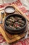 Dolma stuffed grape leaves with rice and meat and sour cream on wooden board