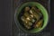 Dolmas - Stuffed vine leaves with rice in a bowl.