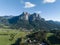 Dolomites alp Seiser Alm beautifull majestic mountain in Tirol north of Italy aerial drone overview. Small village and